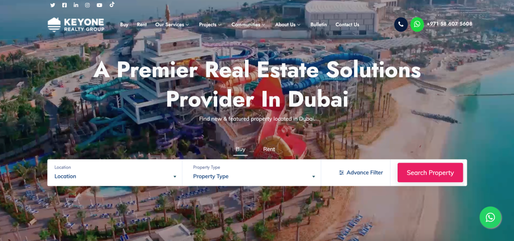 A website homepage for Key One Realty Group displays a beachfront property in Dubai, featuring refined website design and search filters for buying or renting property, alongside a headline stating A Premier Property Solutions Provider In Dubai.