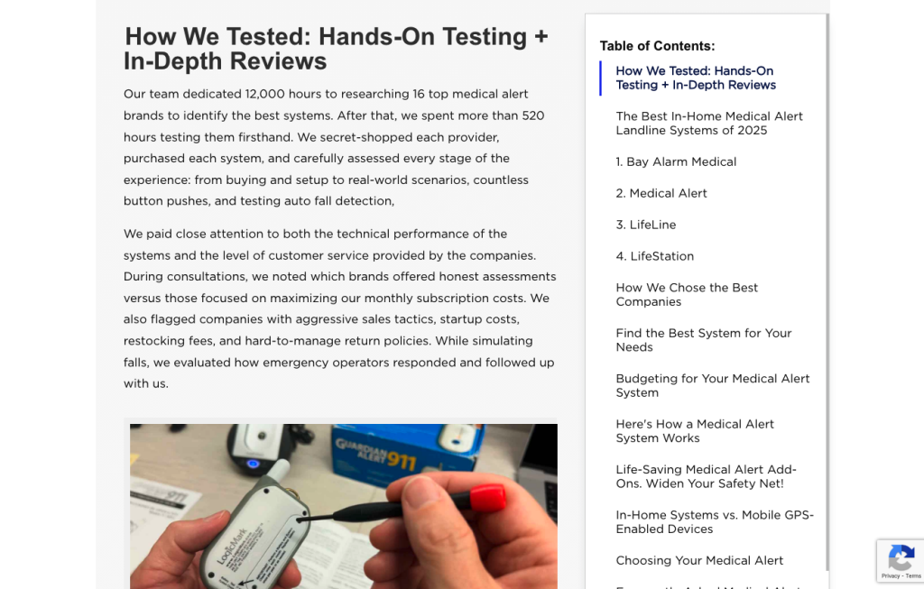 A person’s hands hold and test a small white medical alert device with buttons and a screen; a desktop and more medical devices are visible in the background. The webpage uses brand storytelling to explain hands-on medical alert system testing.