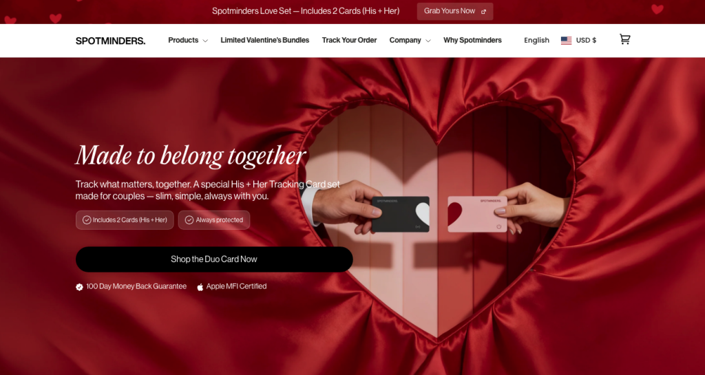 A red curtain shaped like a heart frames two hands holding black and pink cards. Text reads “Made to belong together” and highlights how Spotminders Duo Card Set for couples helps build brand trust by connecting partners beyond online barriers.